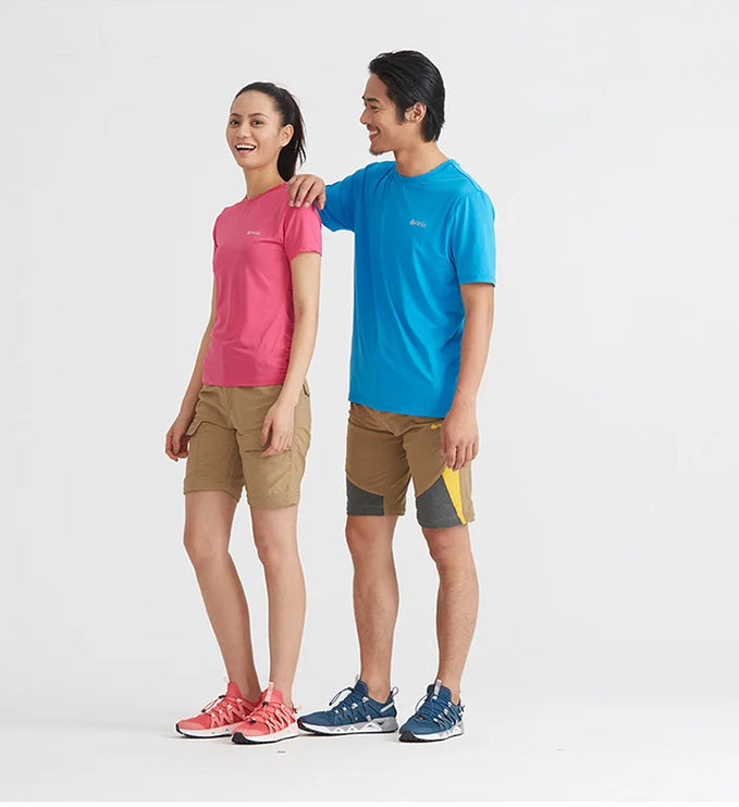 Two people wearing casual outdoor clothing and water shoes, showcasing HydroFlow Aqua Upstream shoes in pink and blue.