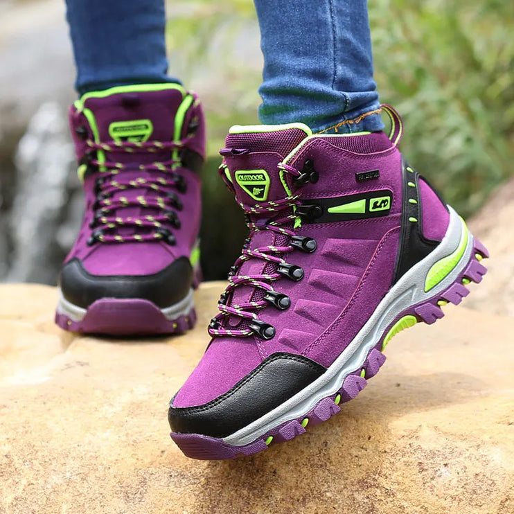 Stylish purple and green waterproof women's winter boots with non-slip rubber soles, perfect for hiking in snowy conditions.