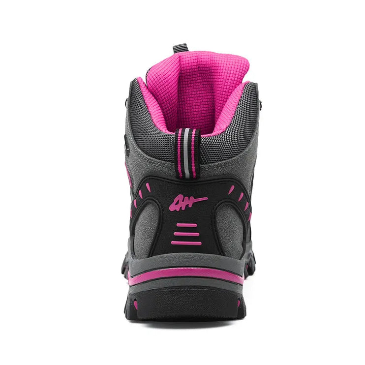 Waterproof women's snow boot with non-slip rubber sole and pink accents for winter protection and comfort.