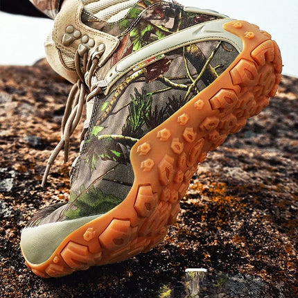 Close-up of TerraGuard Tactical Boot with camouflage pattern on rugged terrain, highlighting durability and grip for outdoor adventures.